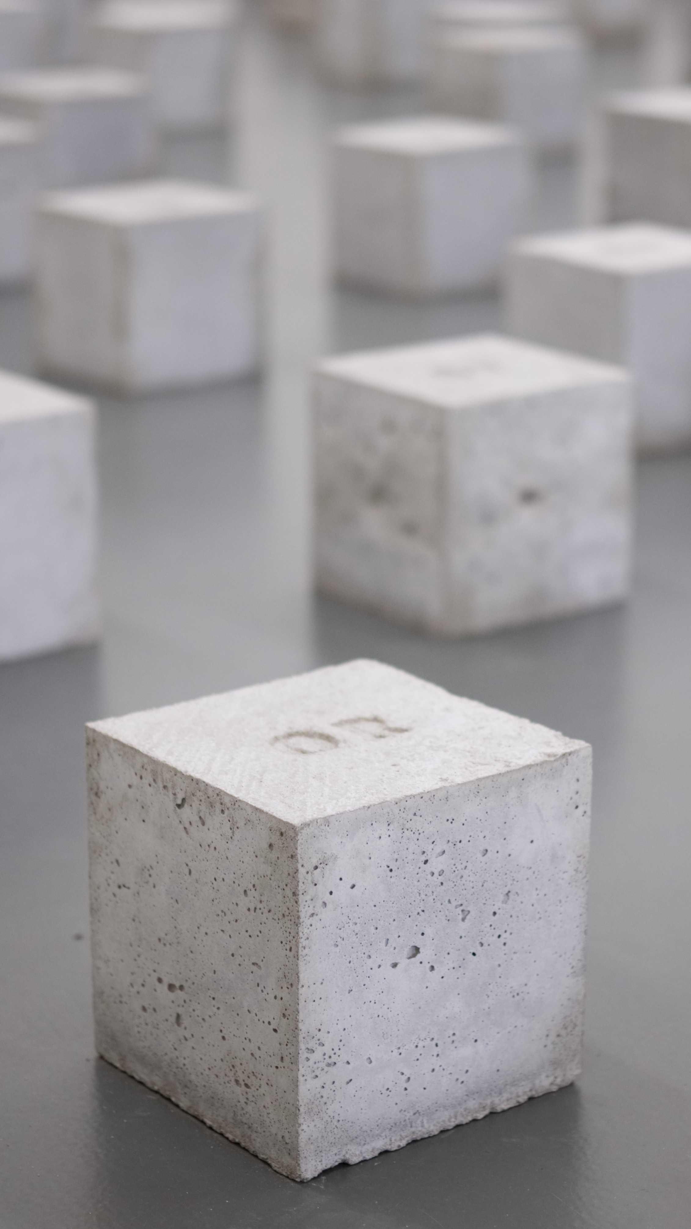 A picture of multiple concrete cubes aligned in a grid
