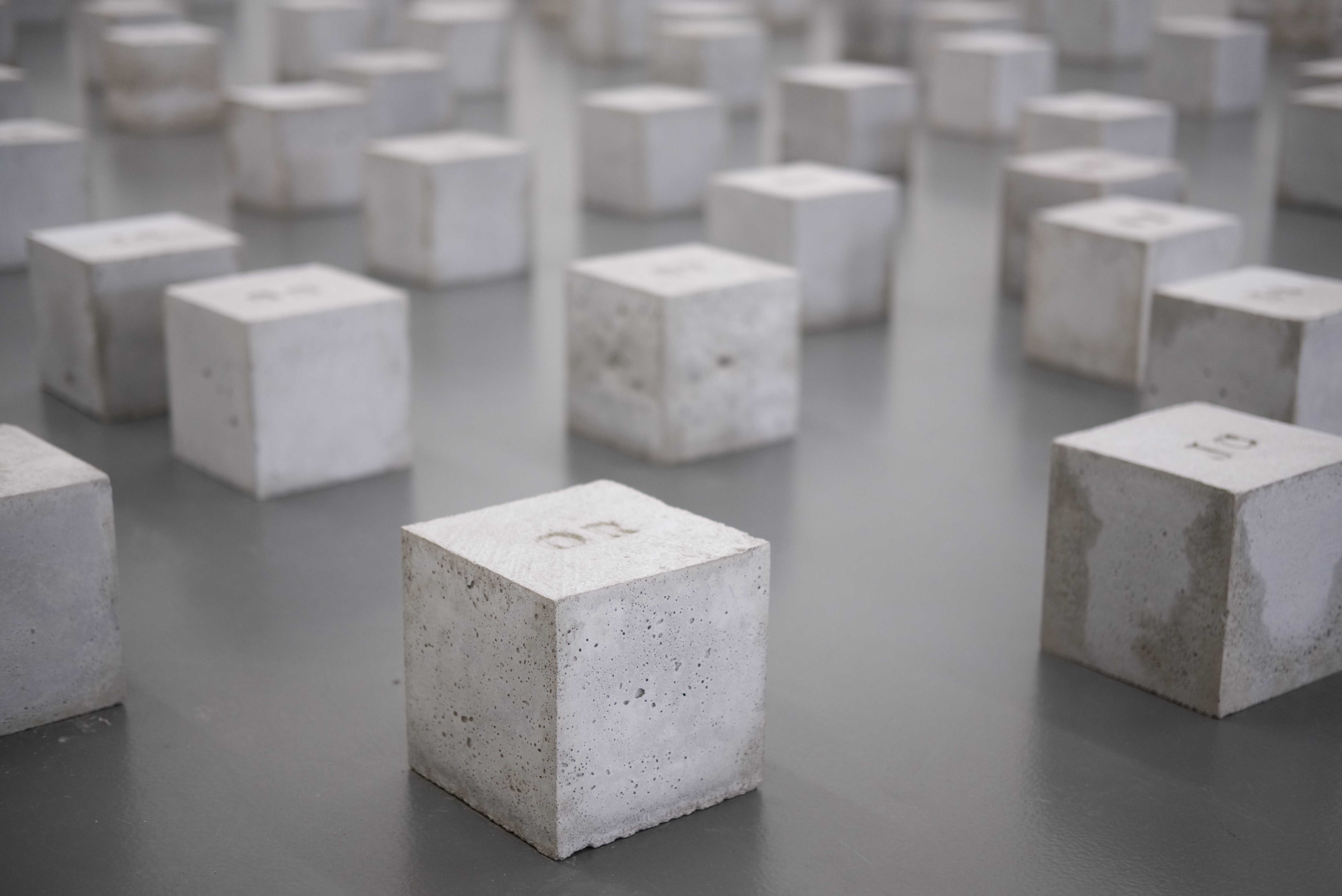 A picture of multiple concrete cubes aligned in a grid